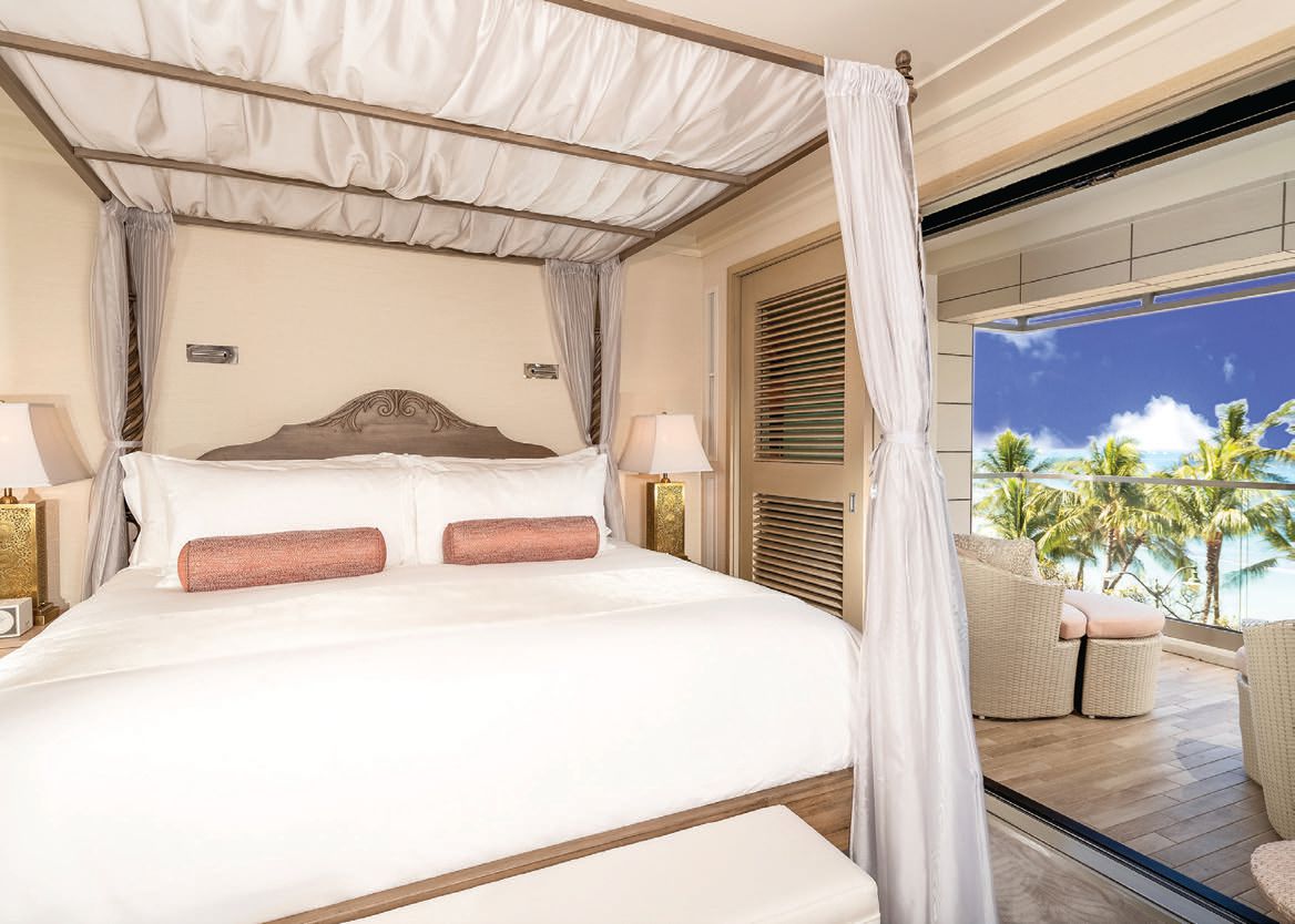 With three bedrooms, each with its own bathroom, the primary bedroom features lanai access. PHOTO COURTESY OF AQUA-ASTON HOSPITALITY